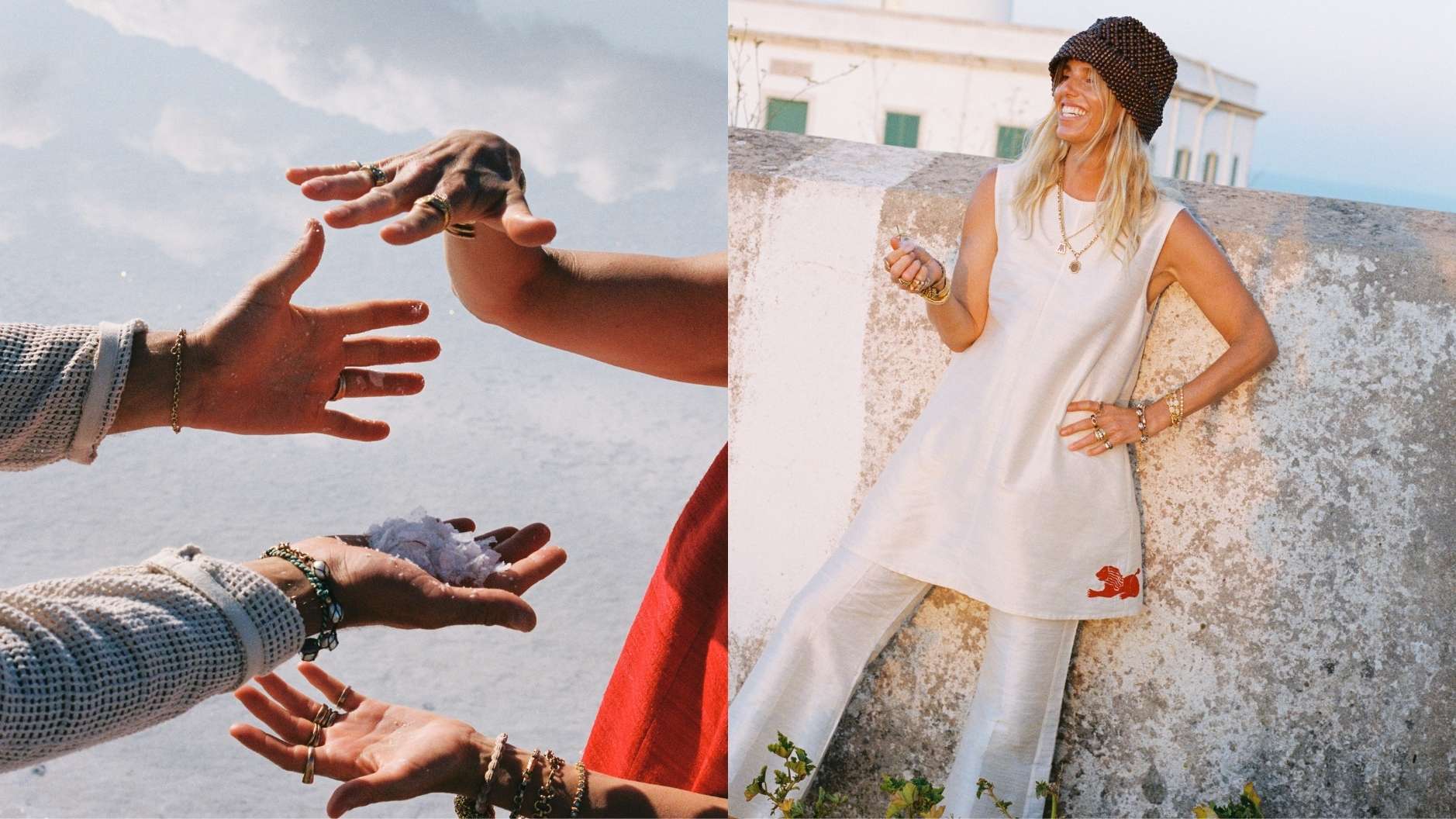 The left side is a detailed close-up of four hands covered in sand, wearing multiple gold rings and beaded bracelets. One hand holds clustered small sea shells, set against a blurry beach background. The right side features a smiling blonde woman with a knitted bucket hat, in a white sleeveless tunic with a red embroidered lion, and linen pants. She leans against a rustic stone wall, adorned with gold necklaces and layered bracelets, holding one hand to her neck.